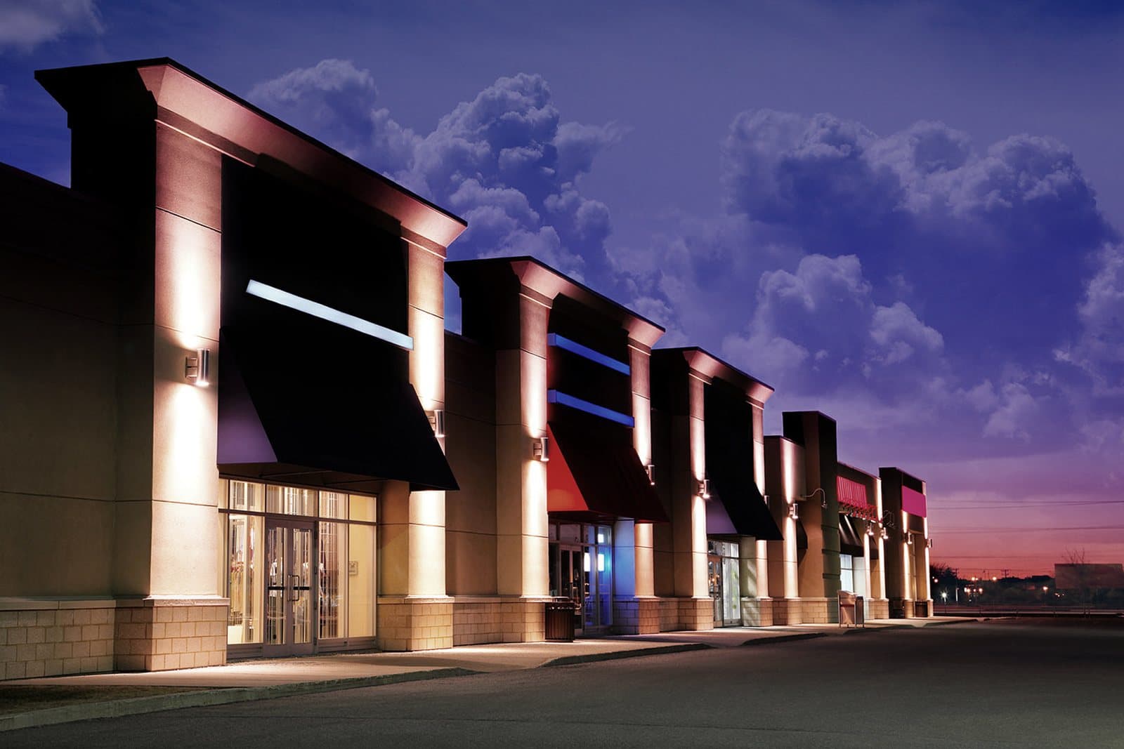 Modern retail strip center at dusk